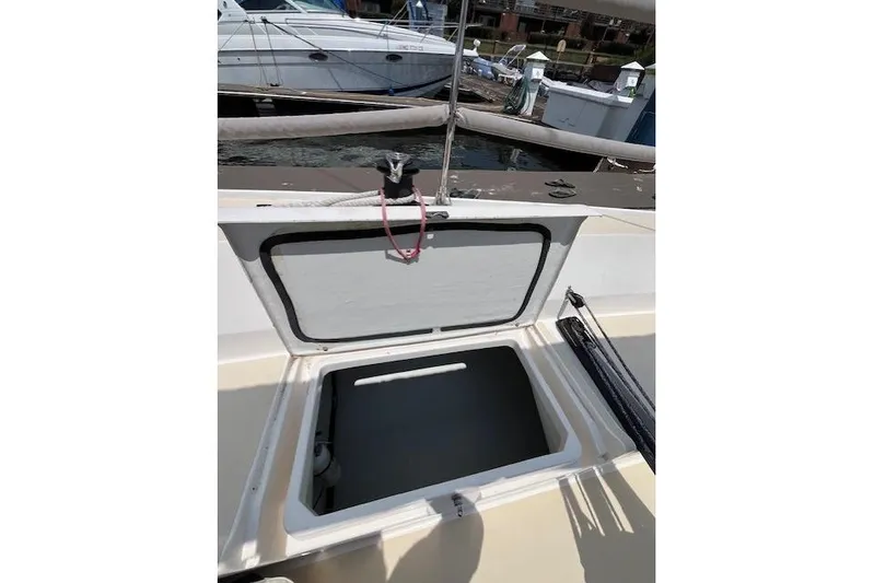  Yacht Photos Pics Open hatch on 2005 J Boats J/100 sailboat deck, docked at marina.