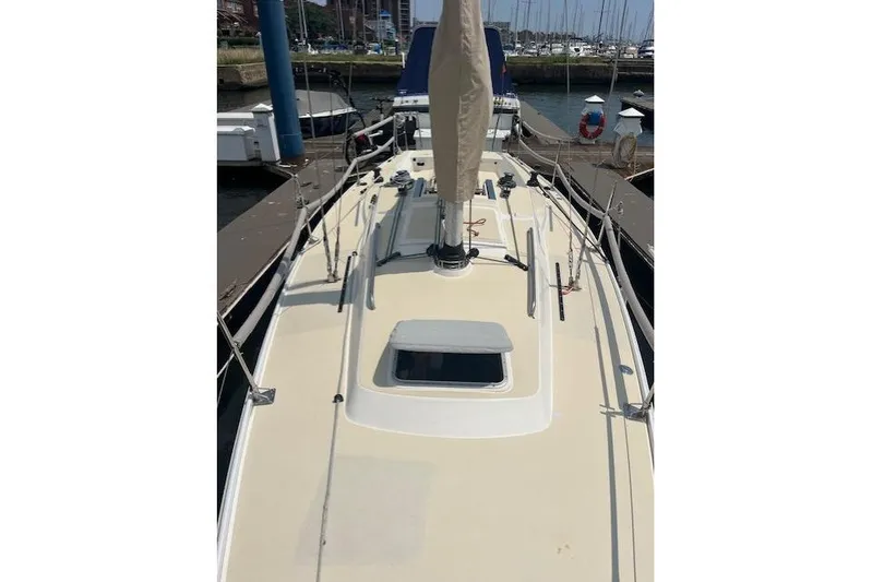  Yacht Photos Pics 2005 J Boats J/100 sailboat docked at marina, view of deck and mast.