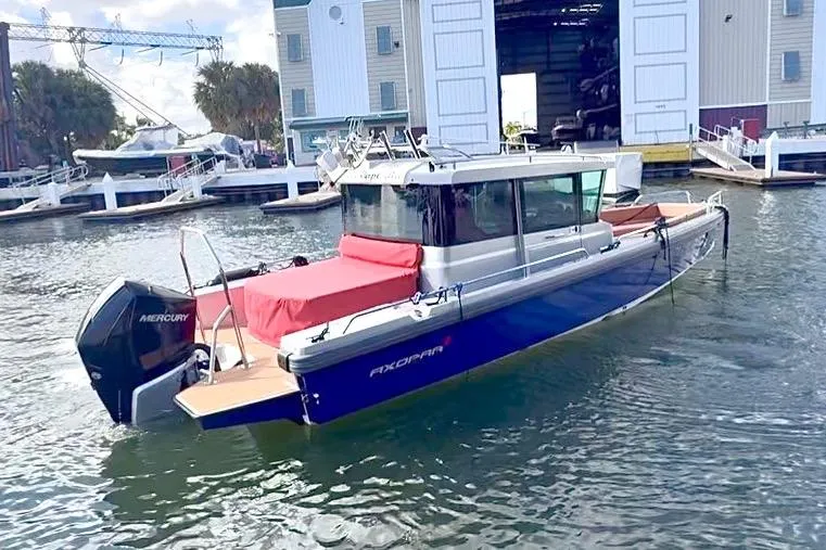  Yacht Photos Pics 2019 Axopar 28 Cabin boat docked at marina with Mercury engine.