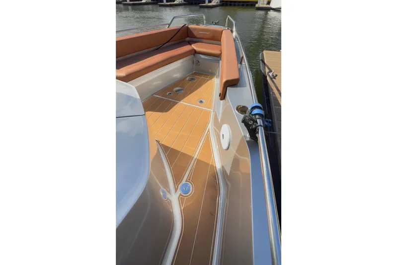  Yacht Photos Pics 2019 Axopar 28 Cabin boat deck with tan seating and wood finish.