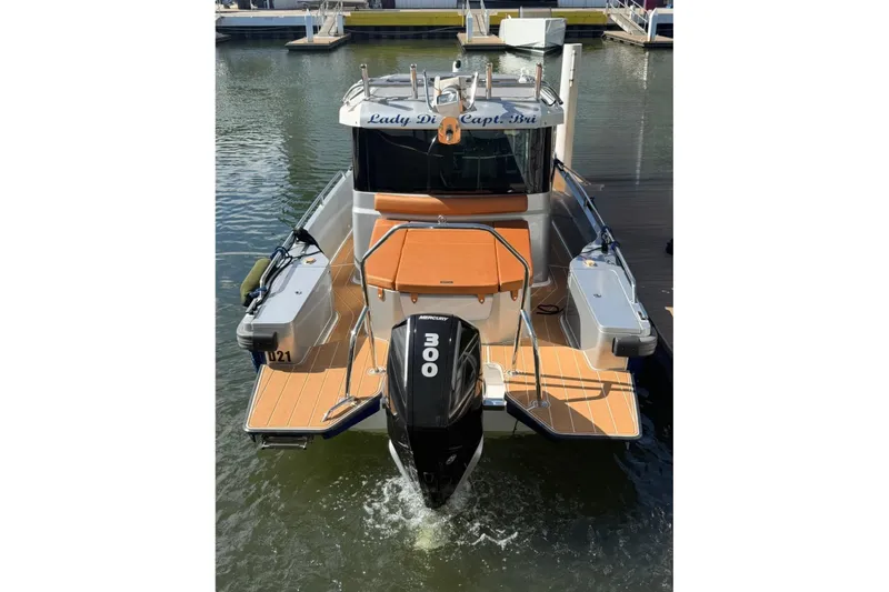  Yacht Photos Pics 2019 Axopar 28 Cabin boat with 300 HP engine docked at marina.
