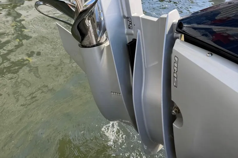  Yacht Photos Pics Outboard motor of 2019 Axopar 28 Cabin boat in water.
