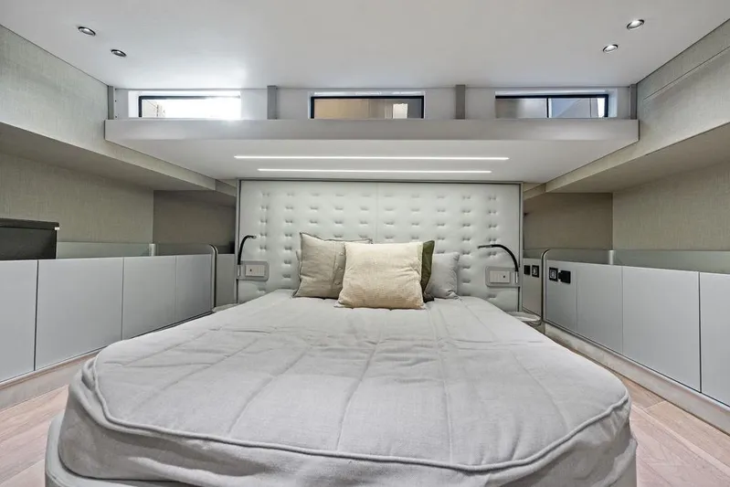  Yacht Photos Pics Luxurious bedroom interior of 2026 SACS Rebel 55 yacht with modern design and plush bedding.