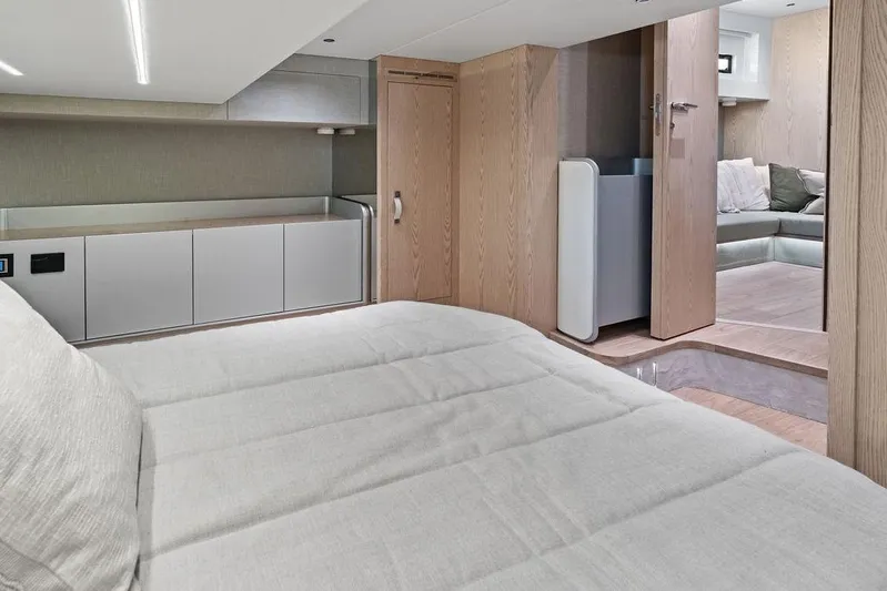  Yacht Photos Pics Luxurious interior of 2026 SACS Rebel 55 yacht with modern furnishings and cozy seating area.