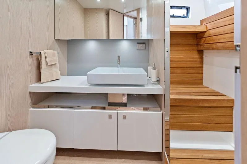 Yacht Photos Pics Modern bathroom interior on 2026 SACS Rebel 55 yacht, featuring sleek design and wooden accents.