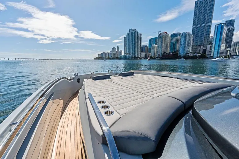  Yacht Photos Pics Luxury SACS Rebel 55 yacht, 2026 model, cruising near city skyline and waterfront.