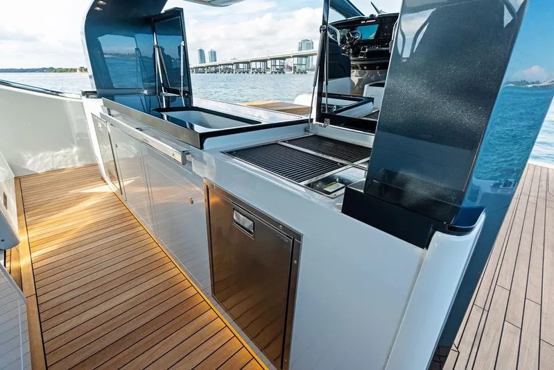  Yacht Photos Pics Luxury outdoor kitchen on 2026 SACS Rebel 55 yacht with sleek design and ocean view.