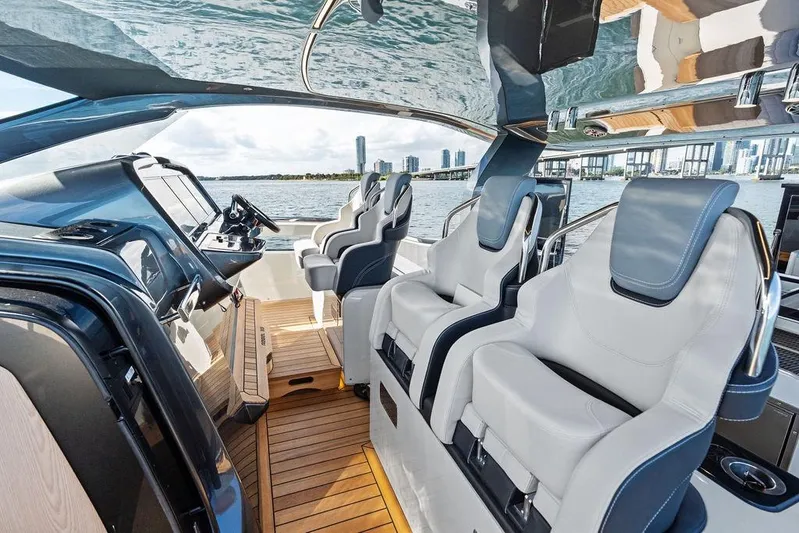  Yacht Photos Pics Interior of 2026 SACS Rebel 55 yacht with luxurious seating and modern dashboard.