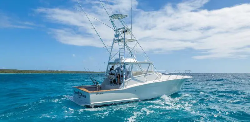 Sea Ghost Yacht Photos Pics 2008 Spencer Custom Carolina Express boat cruising on clear blue ocean waters.