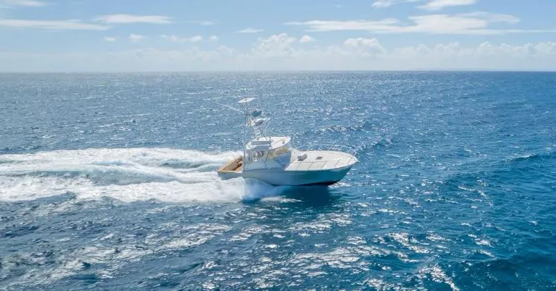 Sea Ghost Yacht Photos Pics 2008 Spencer Custom Carolina Express yacht cruising on open ocean under clear skies.