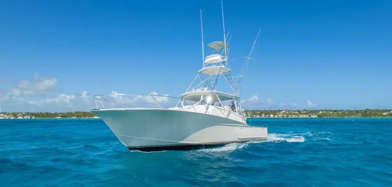 Sea Ghost Yacht Photos Pics 2008 Spencer Custom Carolina Express yacht cruising on clear blue ocean waters.