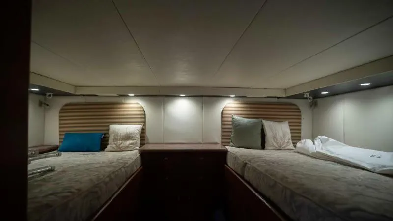 Sea Ghost Yacht Photos Pics Interior cabin of 2008 Spencer Custom Carolina Express with twin beds and ambient lighting.