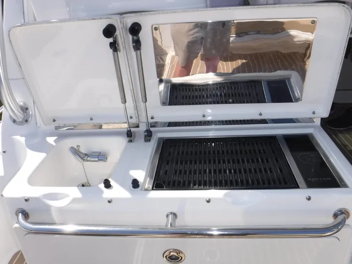  Yacht Photos Pics Boston Whaler 345 Conquest 2008 boat grill and sink setup on deck.