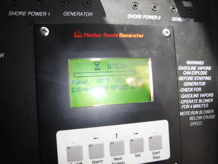  Yacht Photos Pics Control panel of a 2008 Boston Whaler 345 Conquest generator, displaying operational hours.