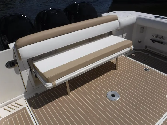  Yacht Photos Pics 2008 Boston Whaler 345 Conquest boat with cushioned seating and teak-style deck.