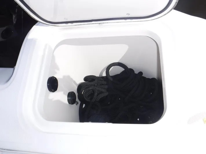  Yacht Photos Pics Storage compartment with black rope on a 2008 Boston Whaler 345 Conquest boat.