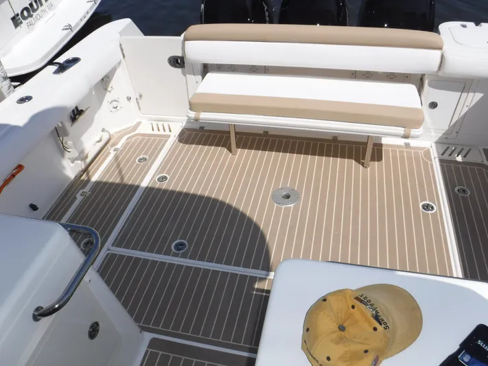  Yacht Photos Pics Spacious deck of 2008 Boston Whaler 345 Conquest with seating and teak flooring.