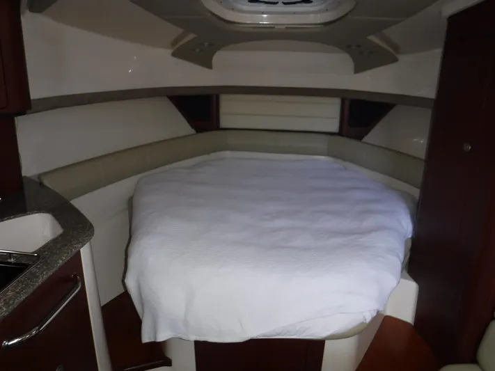  Yacht Photos Pics 2008 Boston Whaler 345 Conquest cabin interior with bed and modern design.