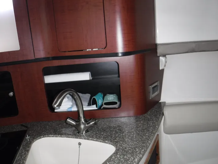  Yacht Photos Pics 2008 Boston Whaler 345 Conquest interior with sink and storage compartments.