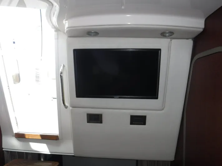  Yacht Photos Pics Interior of a 2008 Boston Whaler 345 Conquest featuring a mounted TV screen.