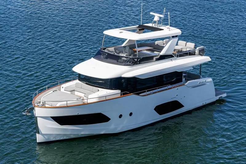  Yacht Photos Pics 2024 Absolute 58 Navetta yacht cruising on open water, showcasing sleek design and luxury features.