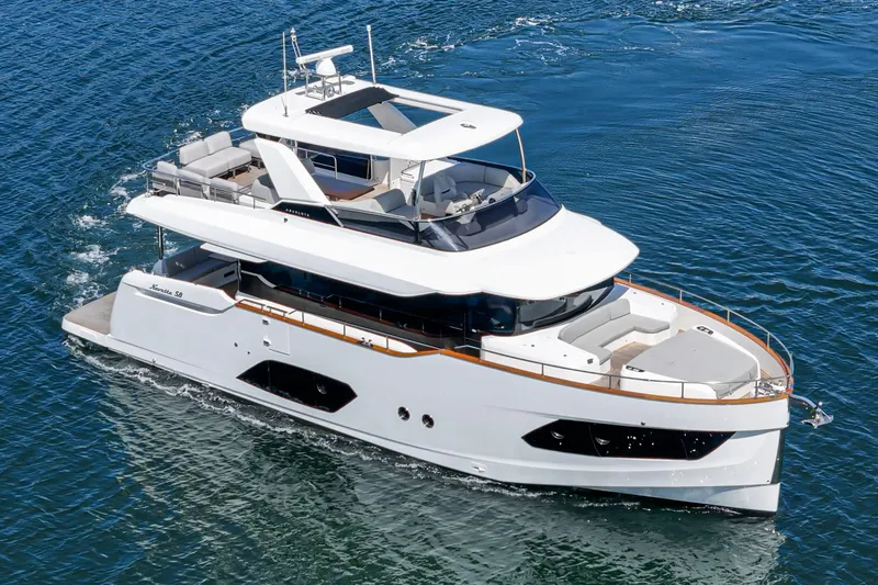  Yacht Photos Pics 2024 Absolute 58 Navetta yacht cruising on open water, showcasing sleek design and luxury features.