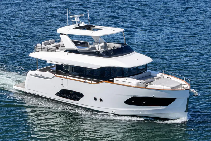  Yacht Photos Pics 2024 Absolute 58 Navetta yacht cruising on open water, showcasing sleek design and luxury features.