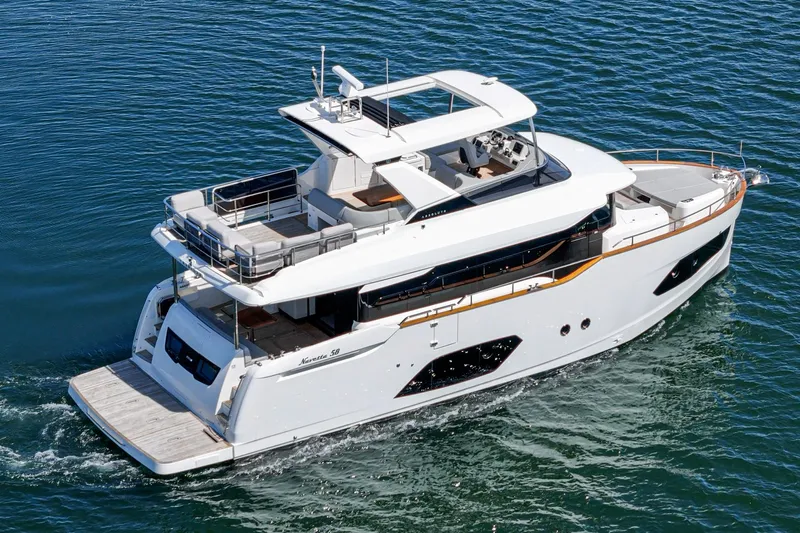  Yacht Photos Pics 2024 Absolute 58 Navetta yacht cruising on calm blue waters.