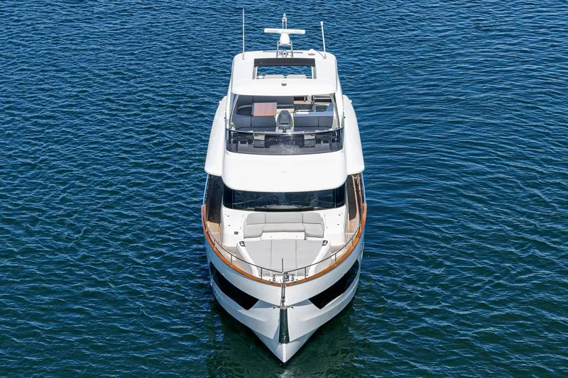  Yacht Photos Pics 2024 Absolute 58 Navetta yacht on calm blue water, aerial front view.