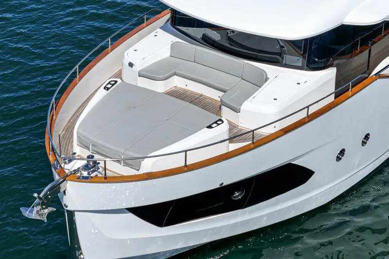  Yacht Photos Pics 2024 Absolute 58 Navetta yacht with spacious deck and modern design on the water.