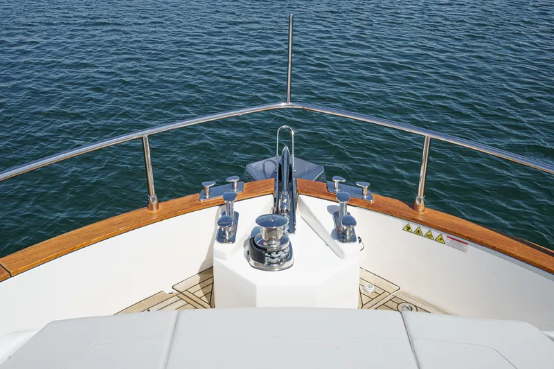  Yacht Photos Pics Bow view of 2024 Absolute 58 Navetta yacht on calm water.