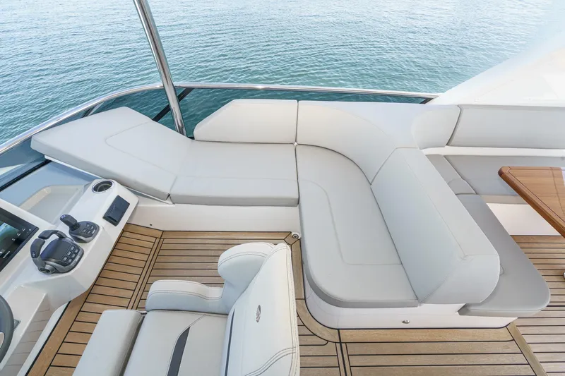  Yacht Photos Pics Luxurious seating area on 2024 Absolute 58 Navetta yacht with elegant design and ocean view.