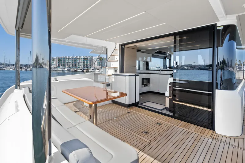  Yacht Photos Pics Luxurious 2024 Absolute 58 Navetta yacht with spacious deck and modern interior design.