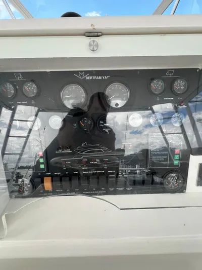 Play Pen Yacht Photos Pics Control panel of a 2001 Bertram 510 Convertible yacht with gauges and switches.