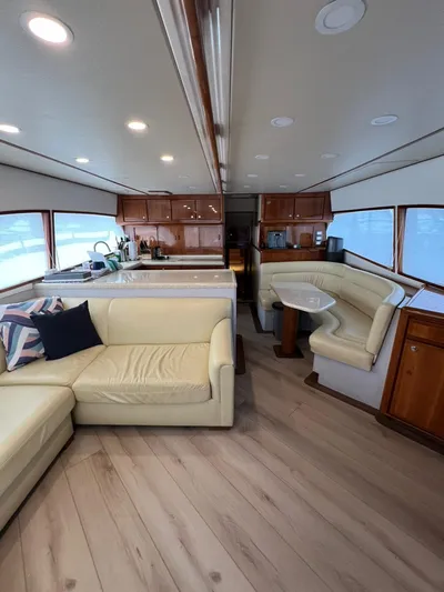 Play Pen Yacht Photos Pics Interior of a 2001 Bertram 510 Convertible yacht with modern furnishings and wood accents.