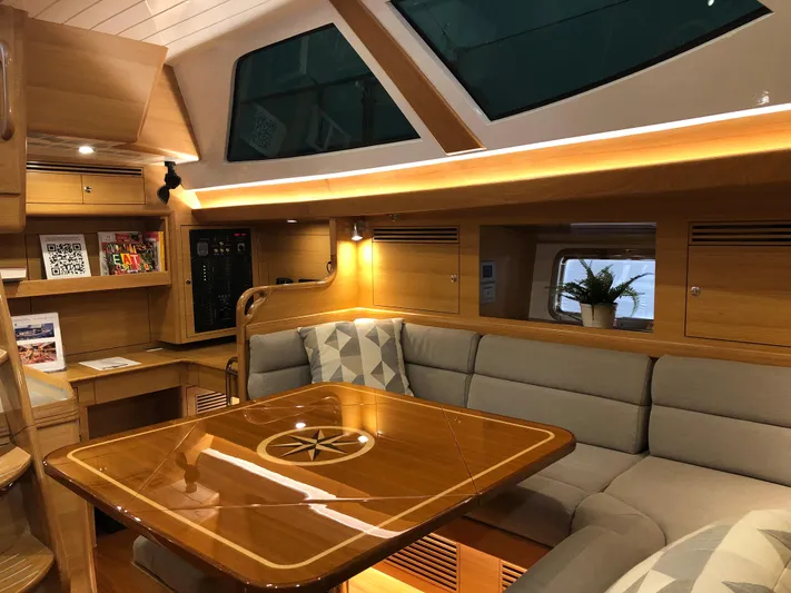 Pneumatic Yacht Photos Pics Luxurious interior of 2020 Bluewater 56 yacht with elegant wood finishes and plush seating.