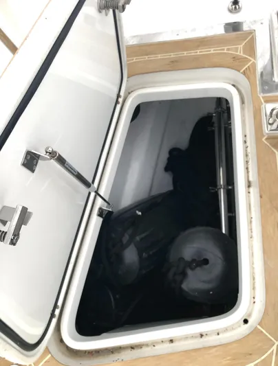 Pneumatic Yacht Photos Pics Open hatch on 2020 Bluewater 56 yacht, revealing interior storage compartment.