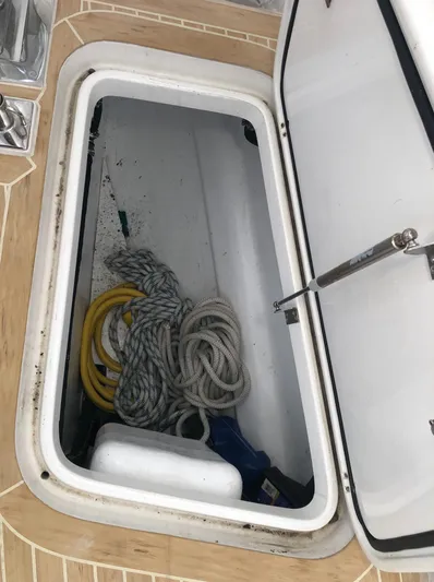 Pneumatic Yacht Photos Pics Open storage compartment on 2020 Bluewater 56 boat with ropes and equipment.