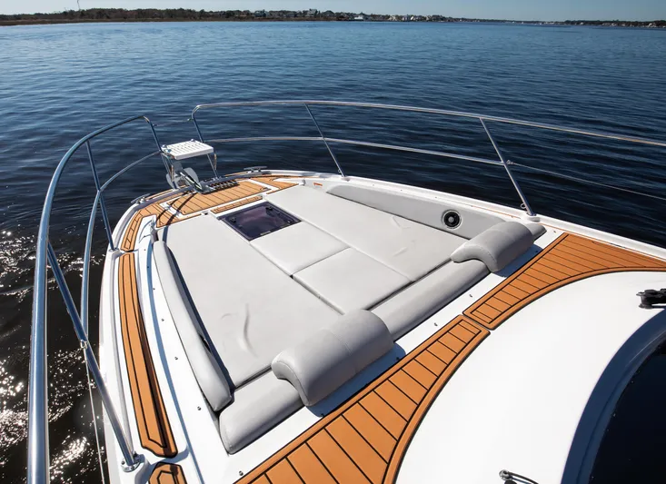  Yacht Photos Pics 2021 Beneteau Gran Turismo 36 bow deck with sunpad and teak flooring.