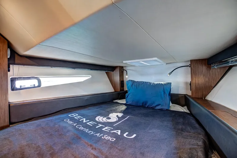  Yacht Photos Pics Interior cabin of 2021 Beneteau Gran Turismo 36 yacht with bed and window.