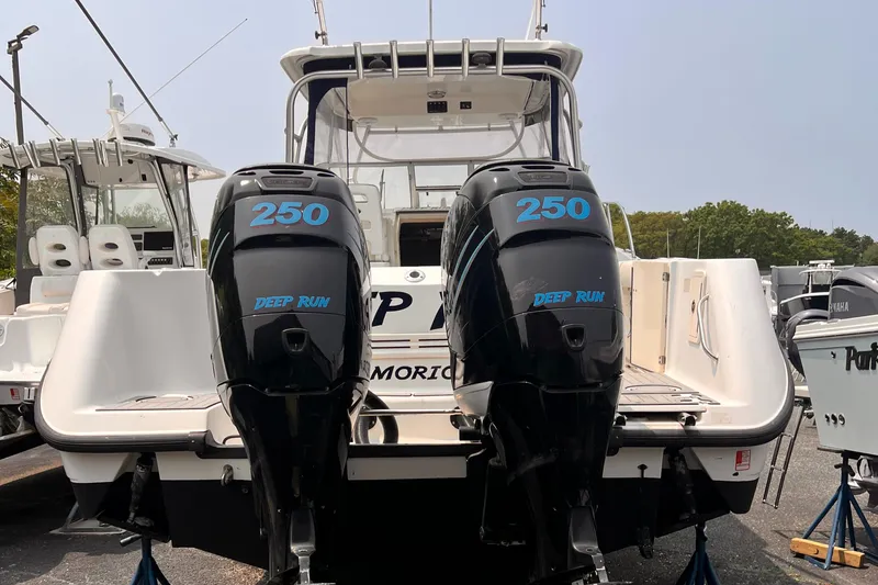  Yacht Photos Pics 2005 Boston Whaler 305 Conquest with twin 250 horsepower engines, docked and ready for adventure.