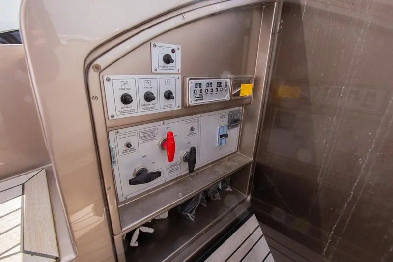  Yacht Photos Pics Control panel on a 2009 Riva 52 Rivale yacht, featuring various switches and controls.