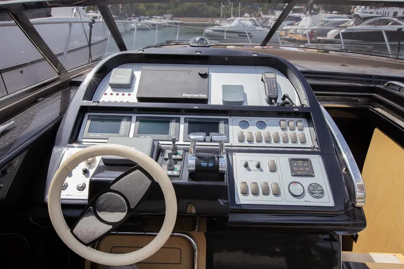  Yacht Photos Pics Cockpit of 2009 Riva 52 Rivale yacht with steering wheel and control panel.