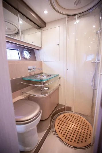  Yacht Photos Pics Luxurious bathroom in 2009 Riva 52 Rivale yacht with modern fixtures and glass sink.