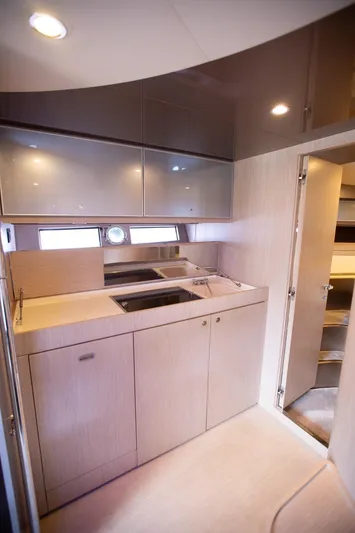  Yacht Photos Pics 2009 Riva 52 Rivale yacht kitchen with modern cabinetry and sleek design.