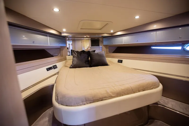  Yacht Photos Pics Luxurious cabin interior of 2009 Riva 52 Rivale yacht with elegant bedding.