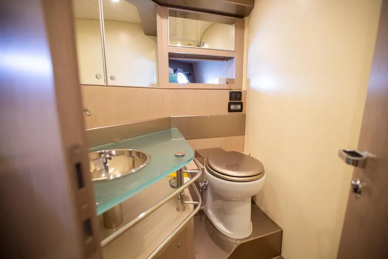  Yacht Photos Pics Luxurious bathroom in a 2009 Riva 52 Rivale yacht, featuring modern fixtures and elegant design.