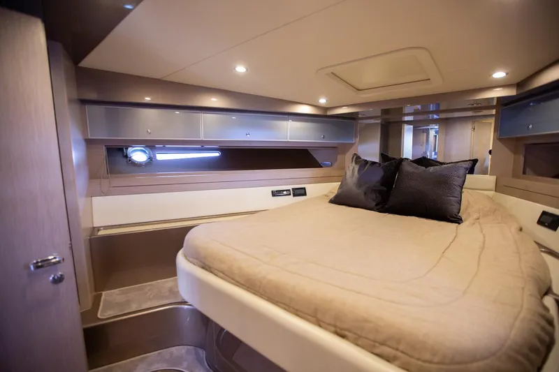  Yacht Photos Pics Luxurious cabin interior of a 2009 Riva 52 Rivale yacht with cozy bedding.