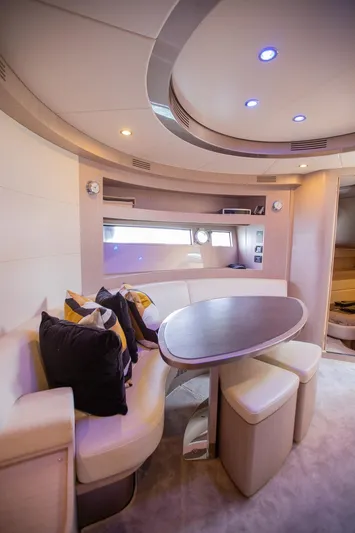  Yacht Photos Pics Luxurious interior of 2009 Riva 52 Rivale yacht with modern seating and ambient lighting.