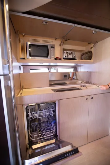  Yacht Photos Pics 2009 Riva 52 Rivale yacht kitchen with modern appliances and sleek cabinetry.